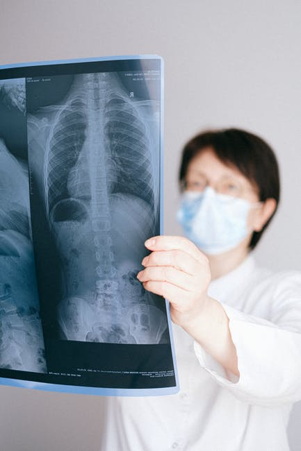 A doctor examining an X-ray.